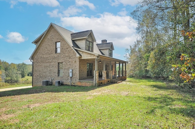 view of home's exterior with a yard and central air condition unit