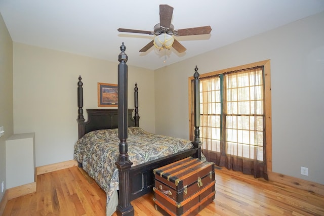 bedroom featuring light hardwood / wood-style floors and ceiling fan