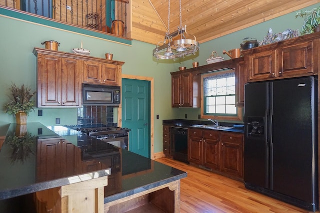 kitchen with sink, high vaulted ceiling, black appliances, wooden ceiling, and light wood-type flooring