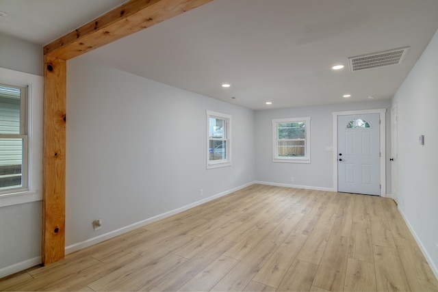 foyer entrance with light hardwood / wood-style floors