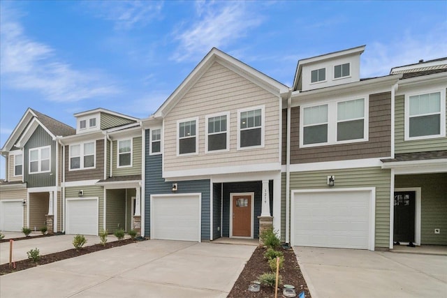 townhome / multi-family property featuring a garage