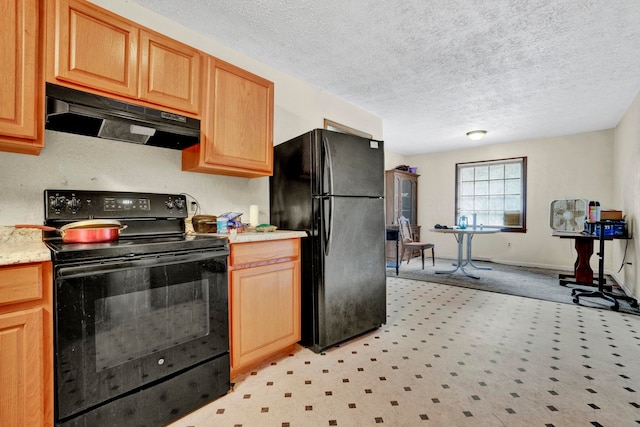 kitchen with black appliances, a textured ceiling, and light carpet