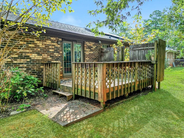 wooden deck with a lawn