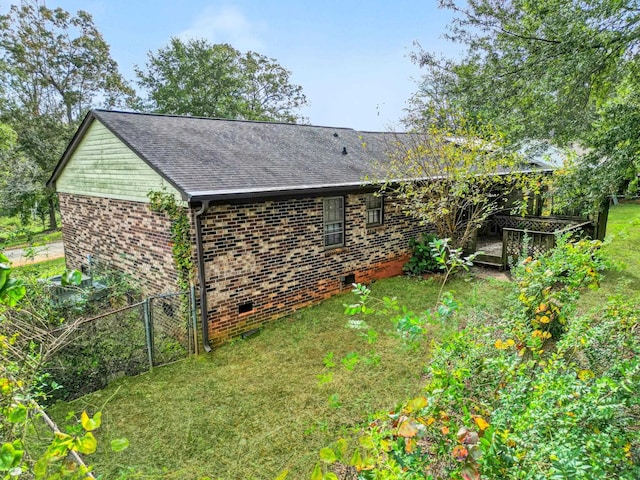 view of home's exterior with a yard