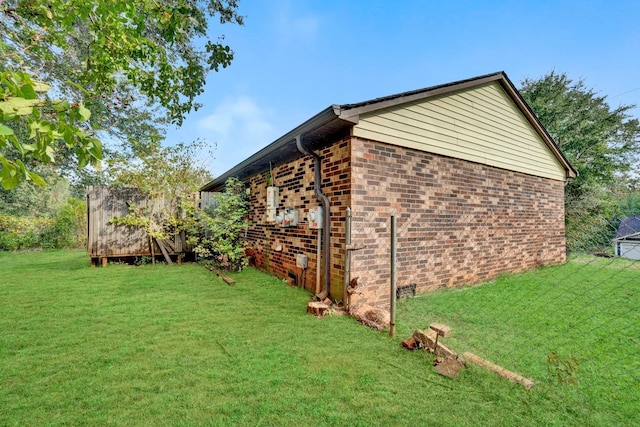 view of property exterior featuring a lawn