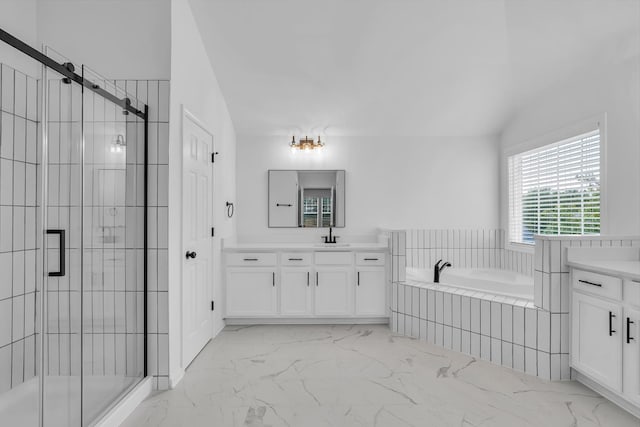 bathroom featuring plus walk in shower and vanity