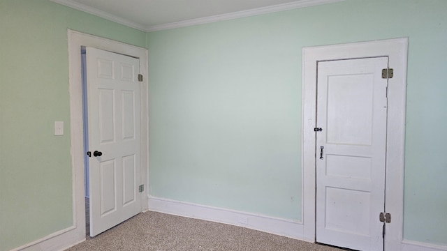 carpeted spare room with ornamental molding