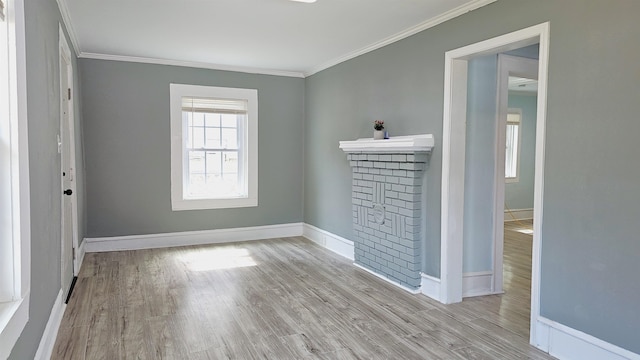 spare room with light hardwood / wood-style flooring and ornamental molding