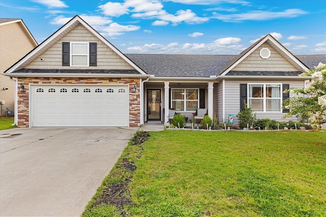 view of front of home with a garage and a front lawn