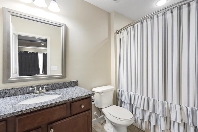 bathroom with vanity, tile patterned flooring, toilet, and a shower with shower curtain