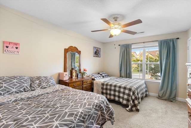 carpeted bedroom with ceiling fan, a textured ceiling, and lofted ceiling