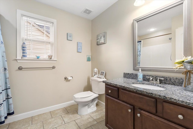 bathroom with vanity, toilet, and curtained shower