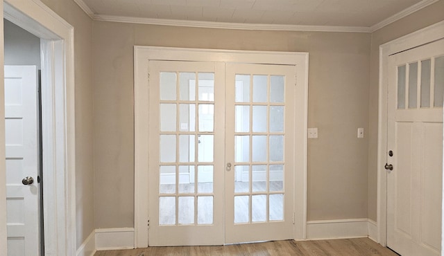 doorway to outside featuring french doors, ornamental molding, plenty of natural light, and light hardwood / wood-style floors