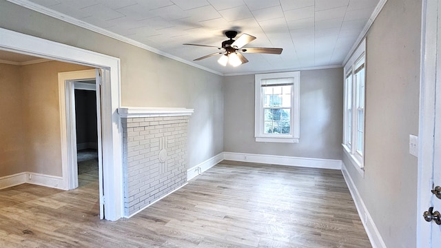 spare room with ornamental molding, light wood-type flooring, and ceiling fan