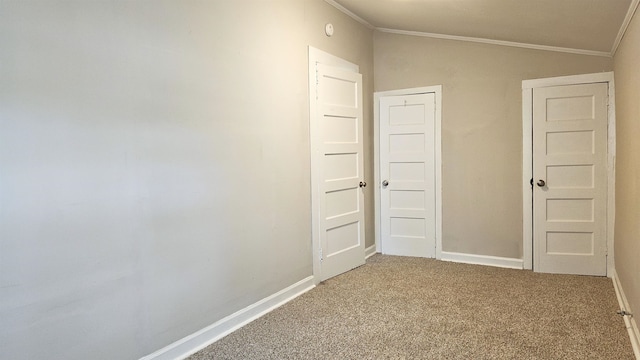 unfurnished bedroom featuring ornamental molding, carpet floors, and vaulted ceiling