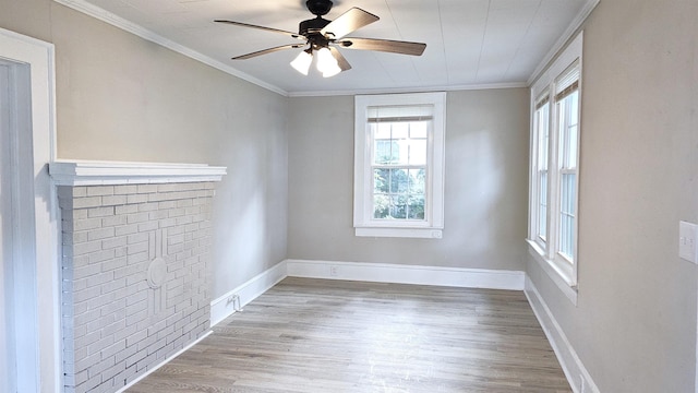 empty room with light hardwood / wood-style floors, crown molding, and ceiling fan