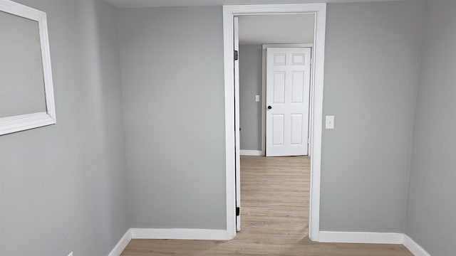 hall with light hardwood / wood-style floors