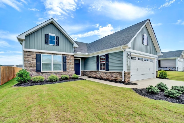 craftsman inspired home featuring a garage and a front yard