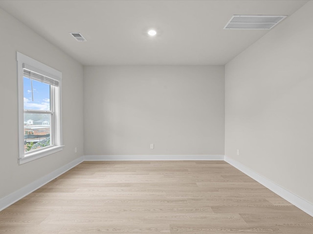 unfurnished room featuring light hardwood / wood-style flooring