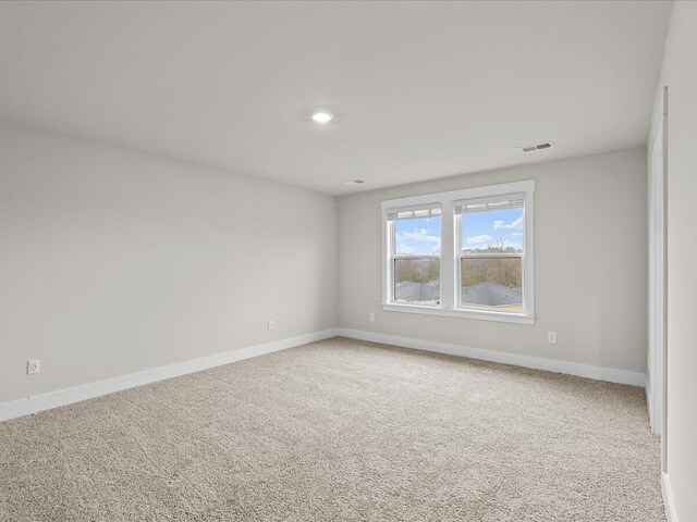 unfurnished room with carpet flooring