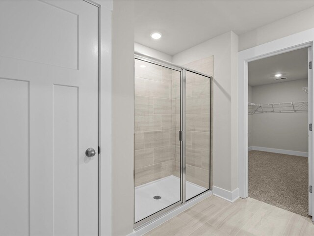 bathroom with an enclosed shower