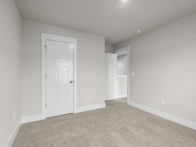 unfurnished bedroom featuring carpet