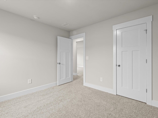 unfurnished bedroom with carpet