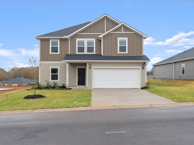 view of front facade featuring a garage and a front lawn