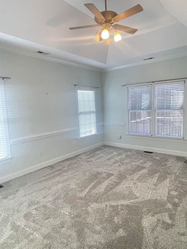 unfurnished room with ornamental molding, carpet floors, and ceiling fan