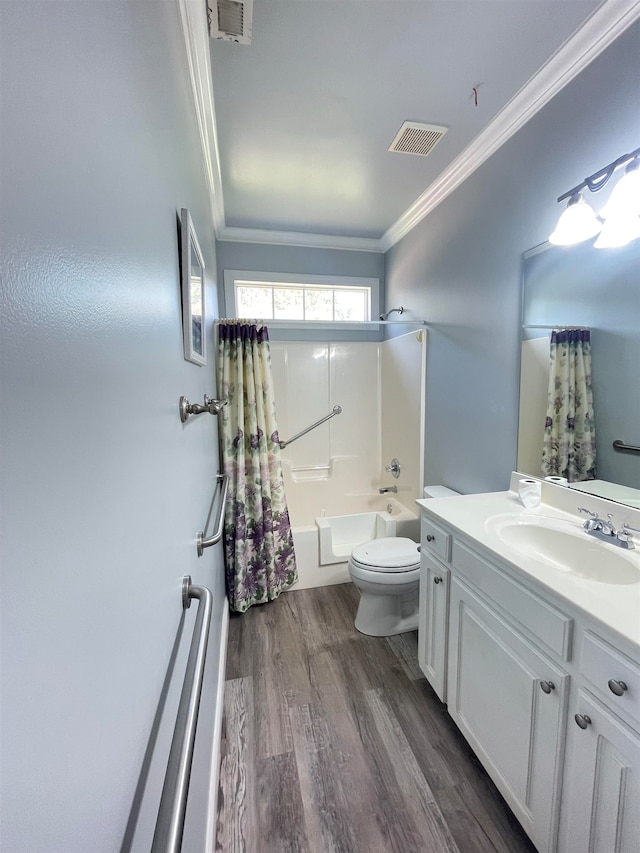 full bathroom with shower / tub combo, wood-type flooring, toilet, vanity, and crown molding