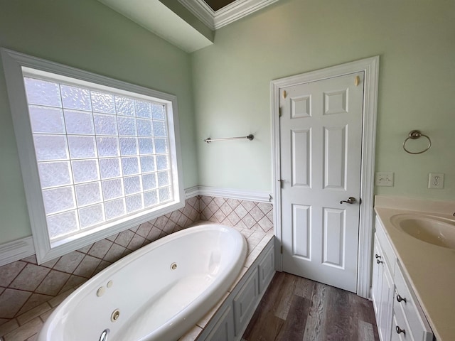 bathroom featuring hardwood / wood-style flooring, a bathtub, vanity, crown molding, and tile walls