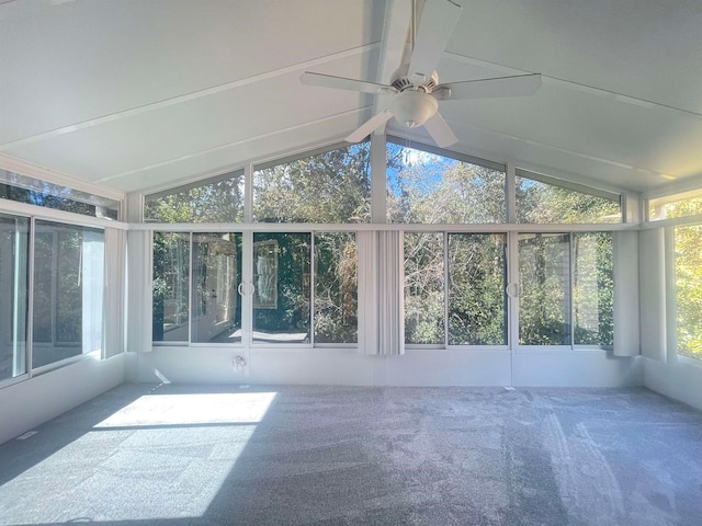 unfurnished sunroom featuring vaulted ceiling and ceiling fan