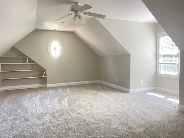 bonus room with ceiling fan, carpet, and vaulted ceiling