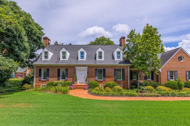 cape cod house featuring a front lawn