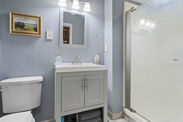 bathroom with vanity, toilet, and walk in shower