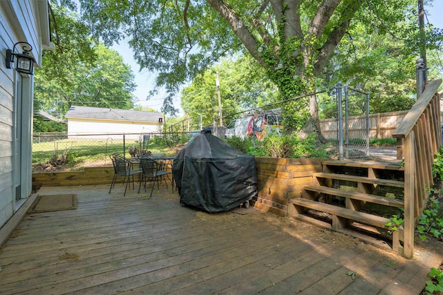 wooden deck with grilling area