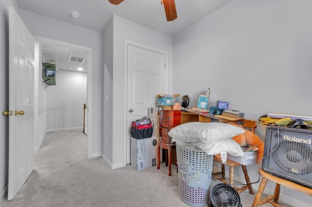 office featuring light carpet and ceiling fan