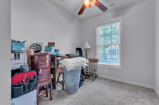 office area with ceiling fan and light carpet