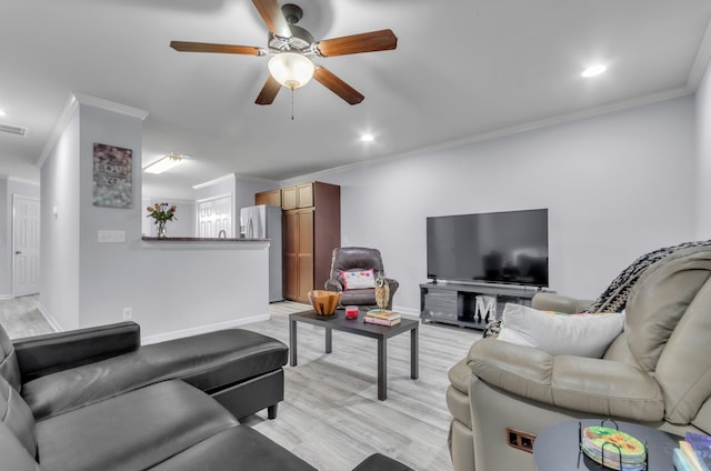 living room with ceiling fan, crown molding, and light hardwood / wood-style flooring