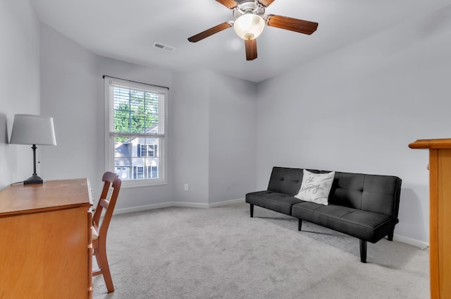 office with light colored carpet and ceiling fan