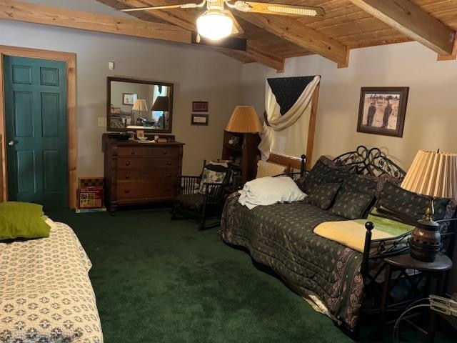 bedroom with beamed ceiling, dark carpet, ceiling fan, and wooden ceiling