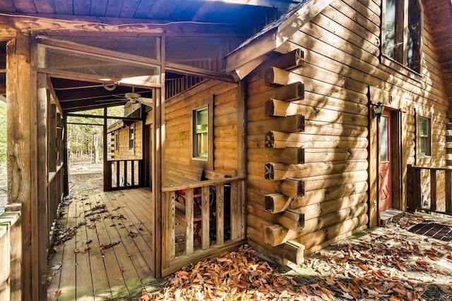 view of side of property with a wooden deck