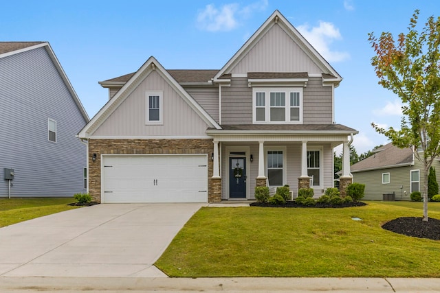 craftsman-style home featuring a front yard, a garage, covered porch, and central air condition unit