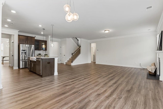 living room featuring crown molding and wood-type flooring