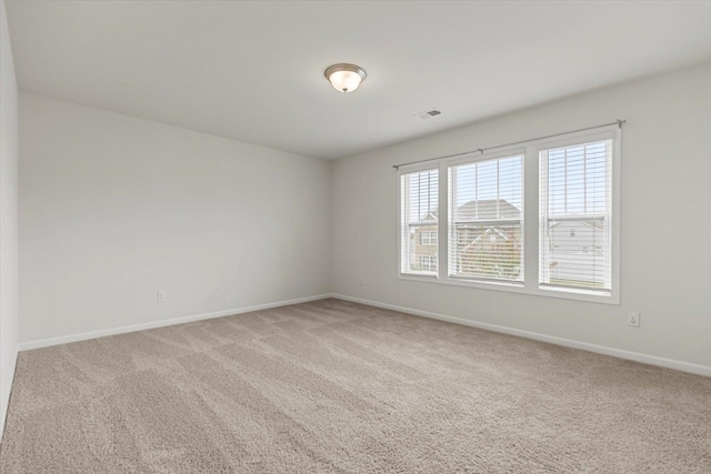 unfurnished room featuring carpet flooring