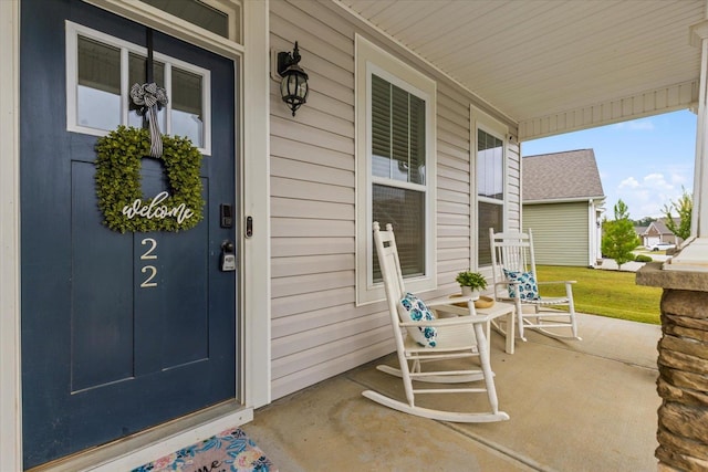 entrance to property featuring a porch