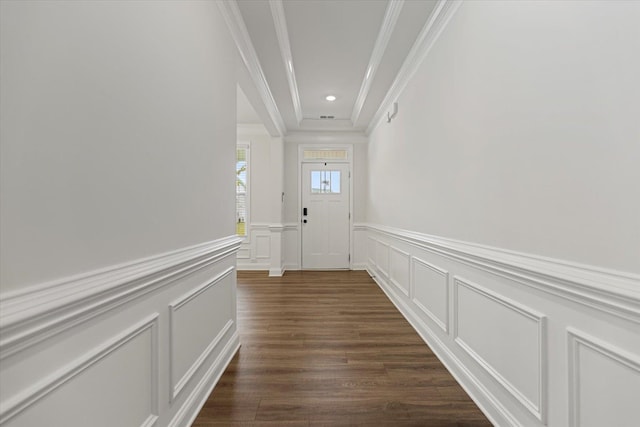 doorway featuring ornamental molding and dark hardwood / wood-style flooring