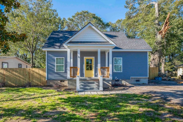 bungalow featuring a front lawn and a porch