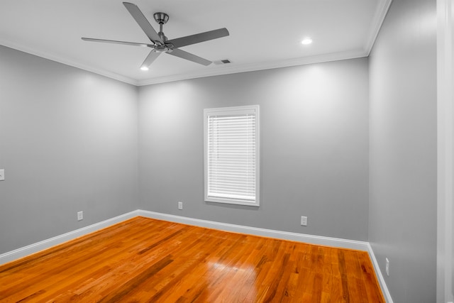 unfurnished room featuring ceiling fan, crown molding, and hardwood / wood-style floors