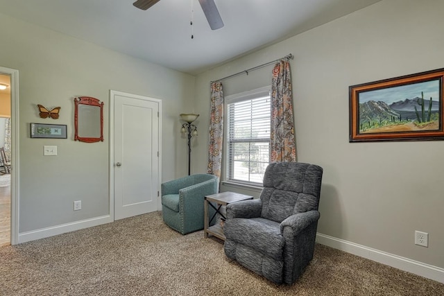 living area with carpet flooring and ceiling fan